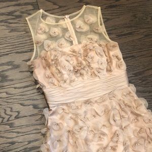 Nude cocktail dress with sewn flowers